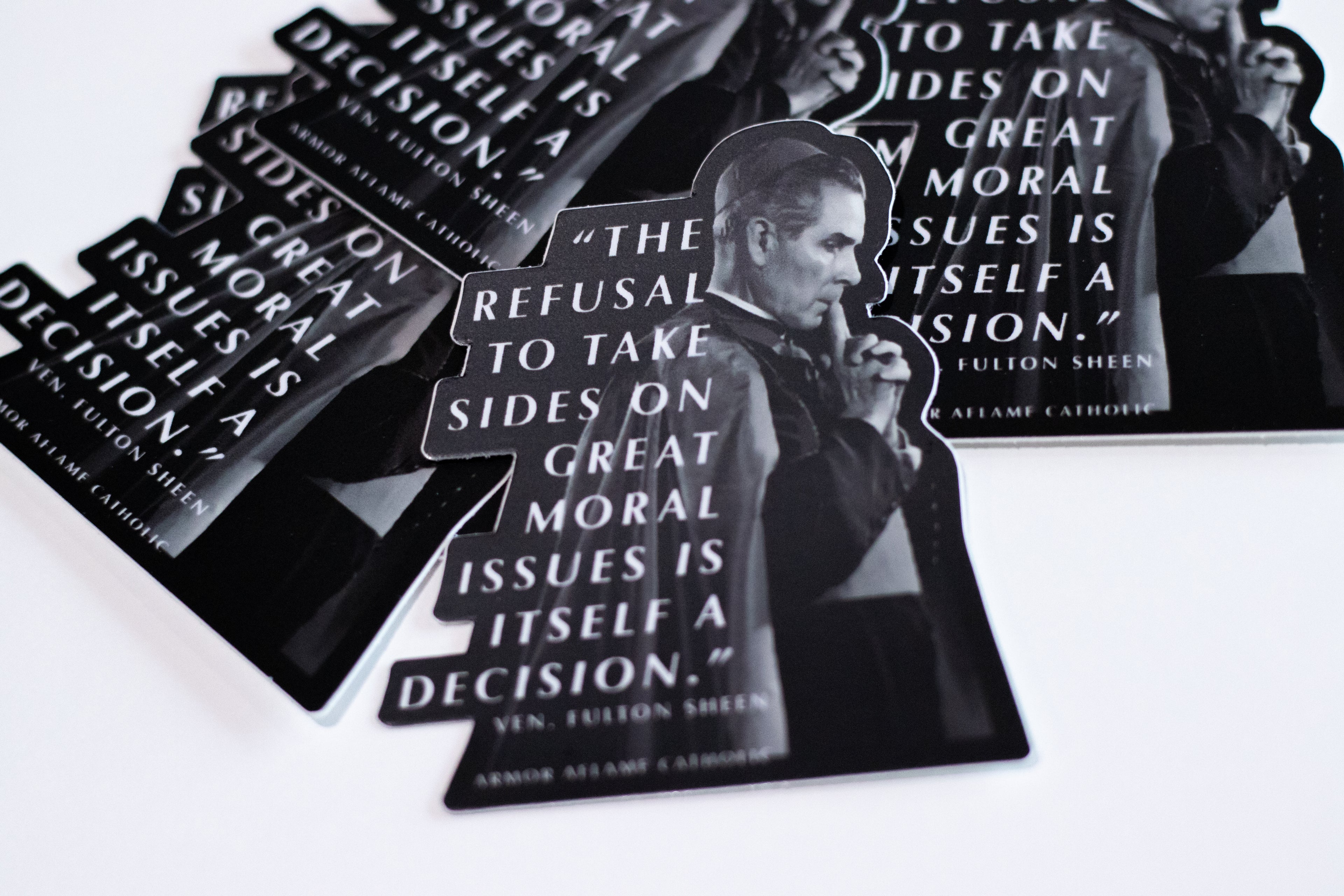 Stickers with a quote by Fulton Sheen on a white surface